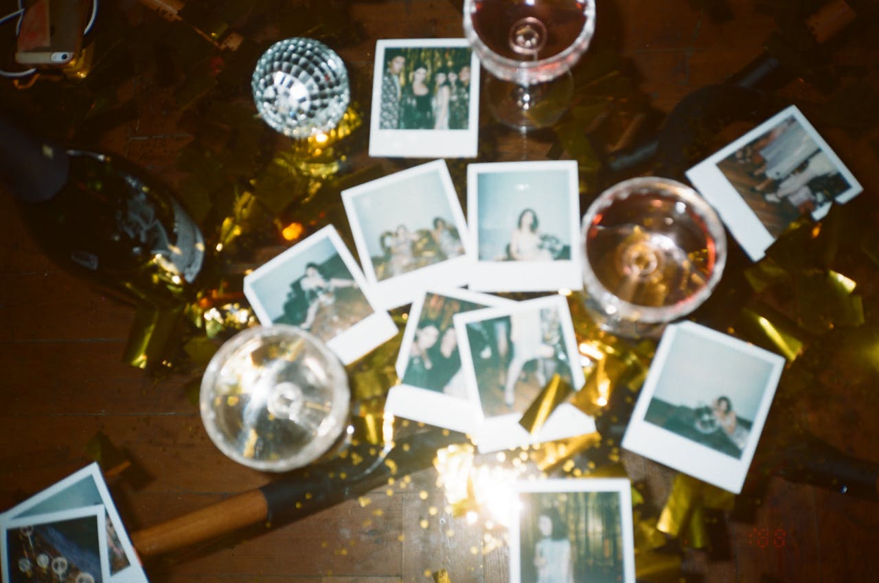Services-03 A nostalgic collection of instant photos amidst a festive party scene with wine glasses and disco decor.